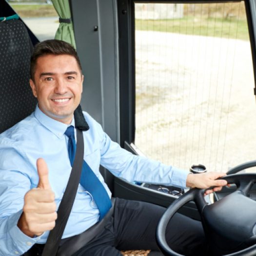 transport-tourism-road-trip-people-concept-happy-driver-driving-intercity-bus-snowing-thumbs-up-1